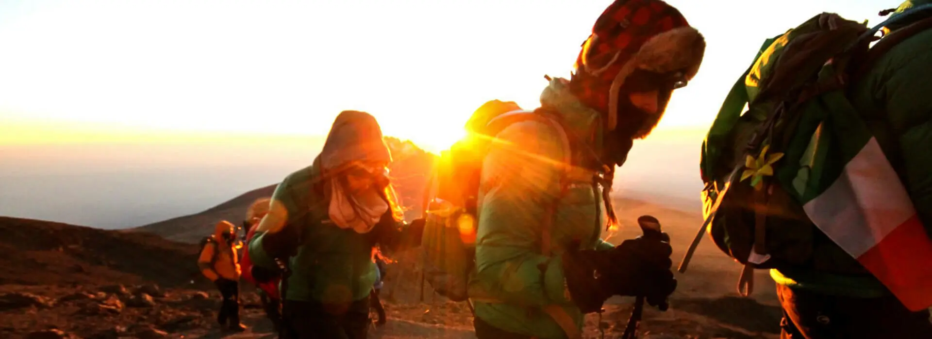 Beginner hikers summiting Kilimanjaro via the Machame Route at sunrise, Tanzania