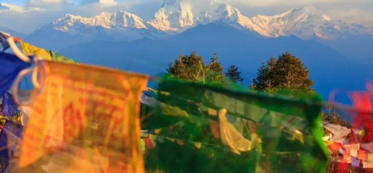 Flags in front of a mountain view in the Annapurna region, Nepal.