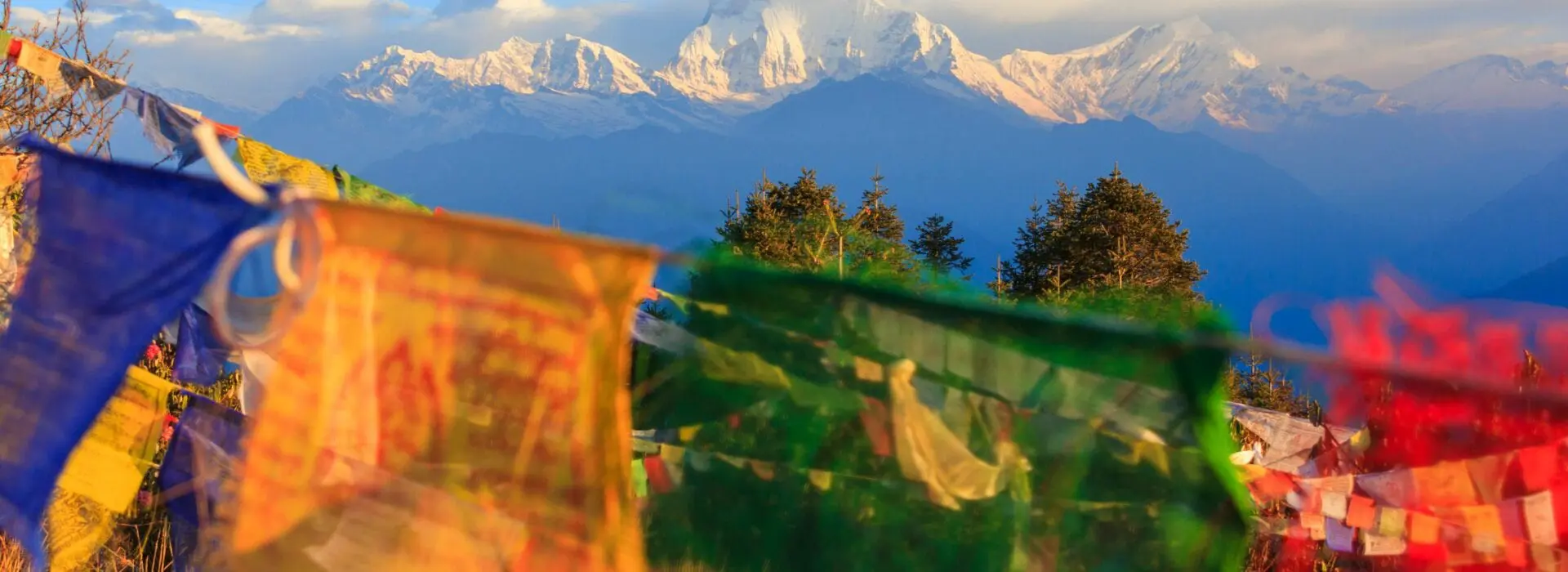 Flags in front of a mountain view in the Annapurna region, Nepal.
