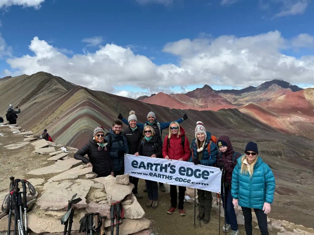 A team of Earth's Edge trekkers at Rainbow Mountain in Peru after their Machu Picchu Trek