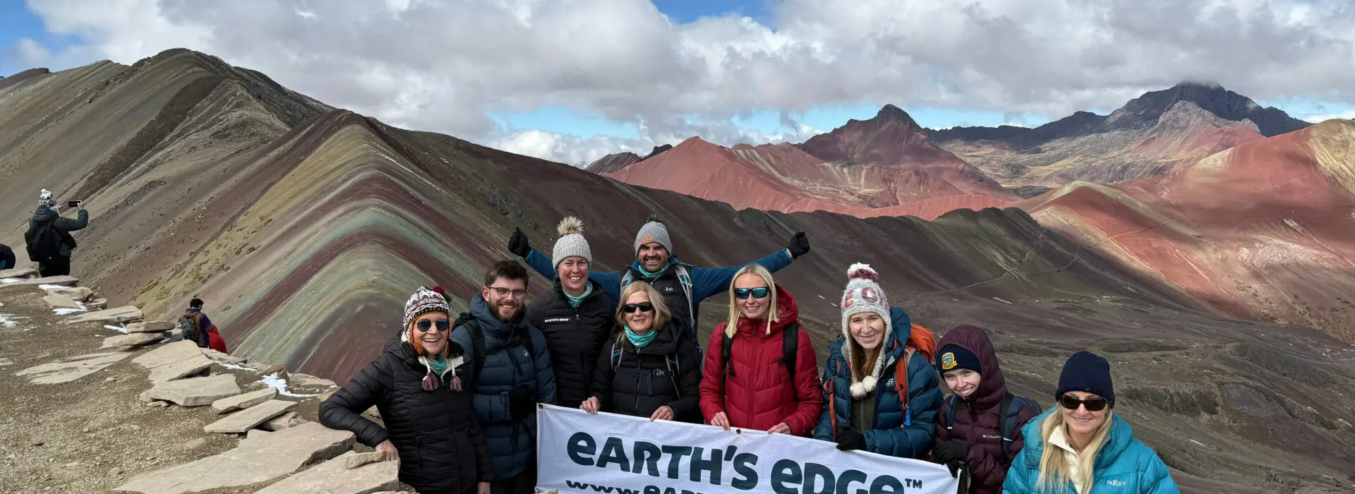 A team of Earth's Edge trekkers at Rainbow Mountain in Peru after their Machu Picchu Trek