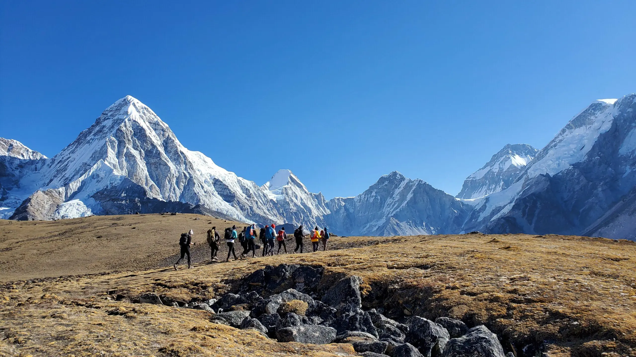 Small group hike with Earth’s Edge on the Everest Base Camp route, surrounded by mountain views