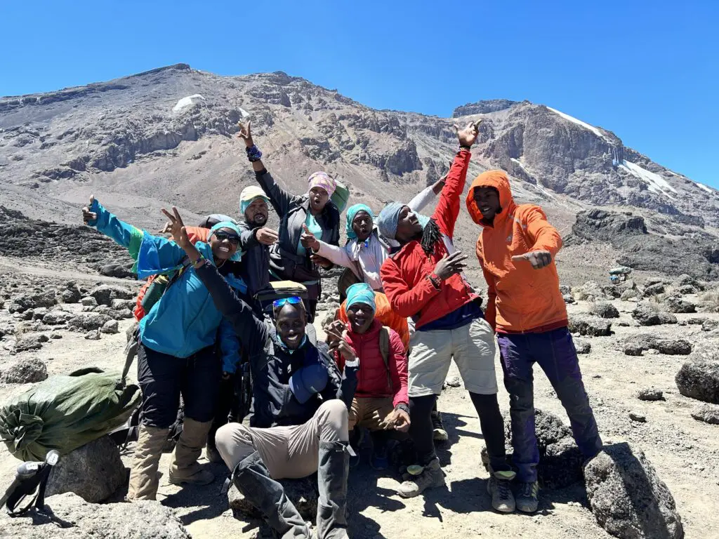A happy group of Earth's Edge guides and porters on Kilimanjaro