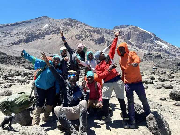 A happy group of Earth's Edge guides and porters on Kilimanjaro