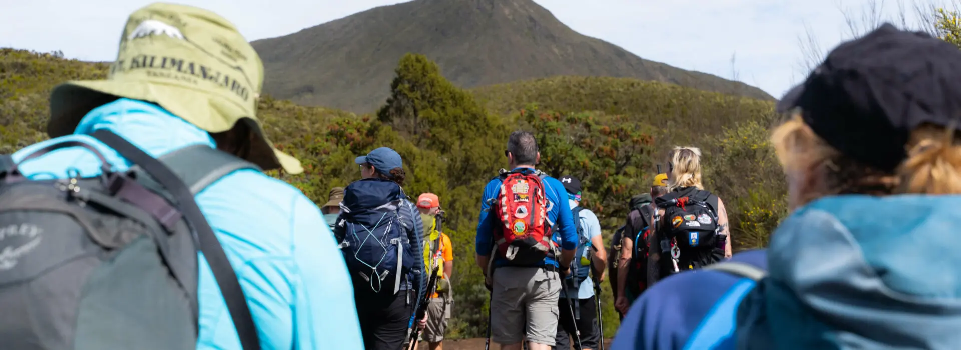 A group of trekkers looking toward Mt. Kenya during daytime while heading for the summit