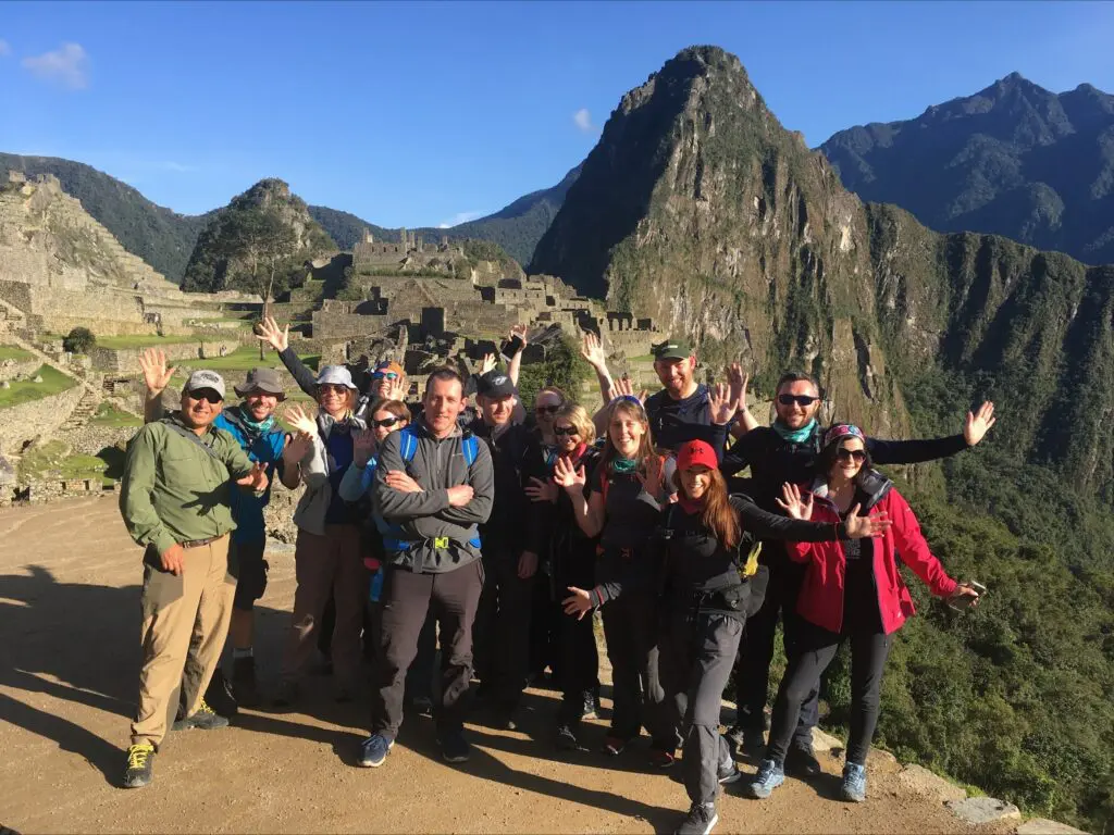 An Earth's Edge Expedition doctor with a group of happy clients at Machu Picchu