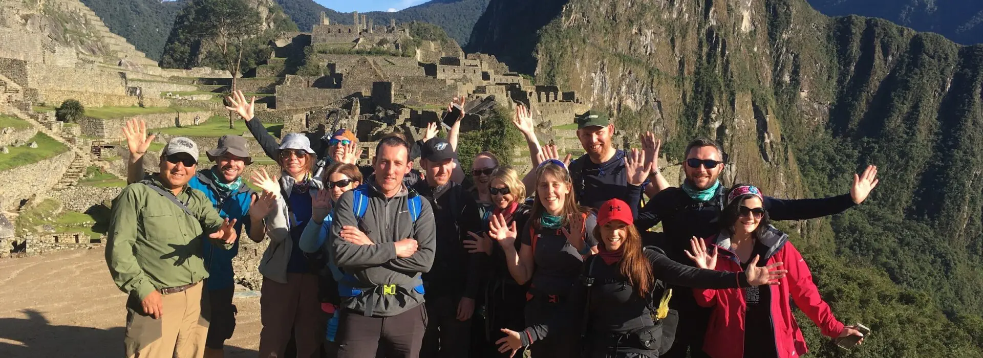 An Earth's Edge Expedition doctor with a group of happy clients at Machu Picchu