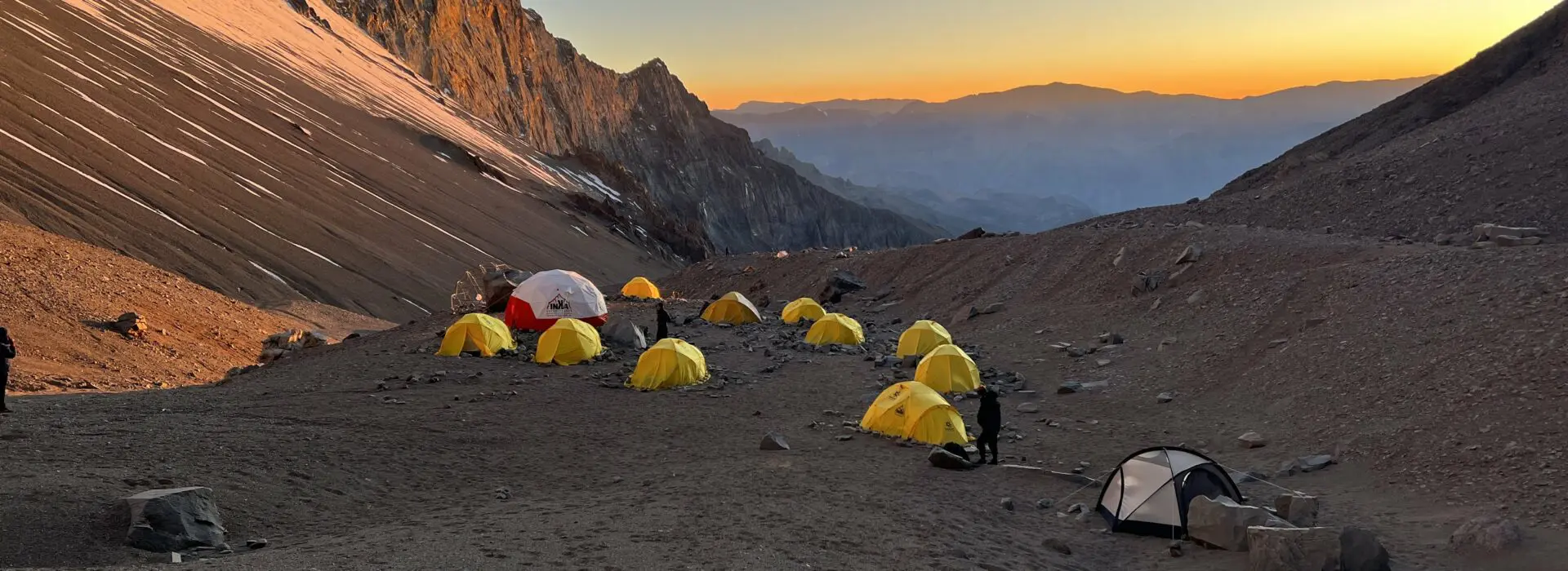 Tents on Aconcagua Camp 1 at sunrise where an expedition doctor is a vital part of the Earth's Edge expedition
