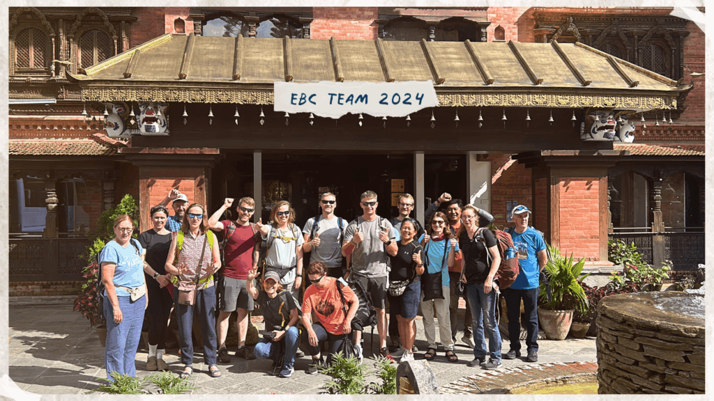 An Earth's Edge group of trekkers posing for a photo at the end of their Everest Base Camp trek