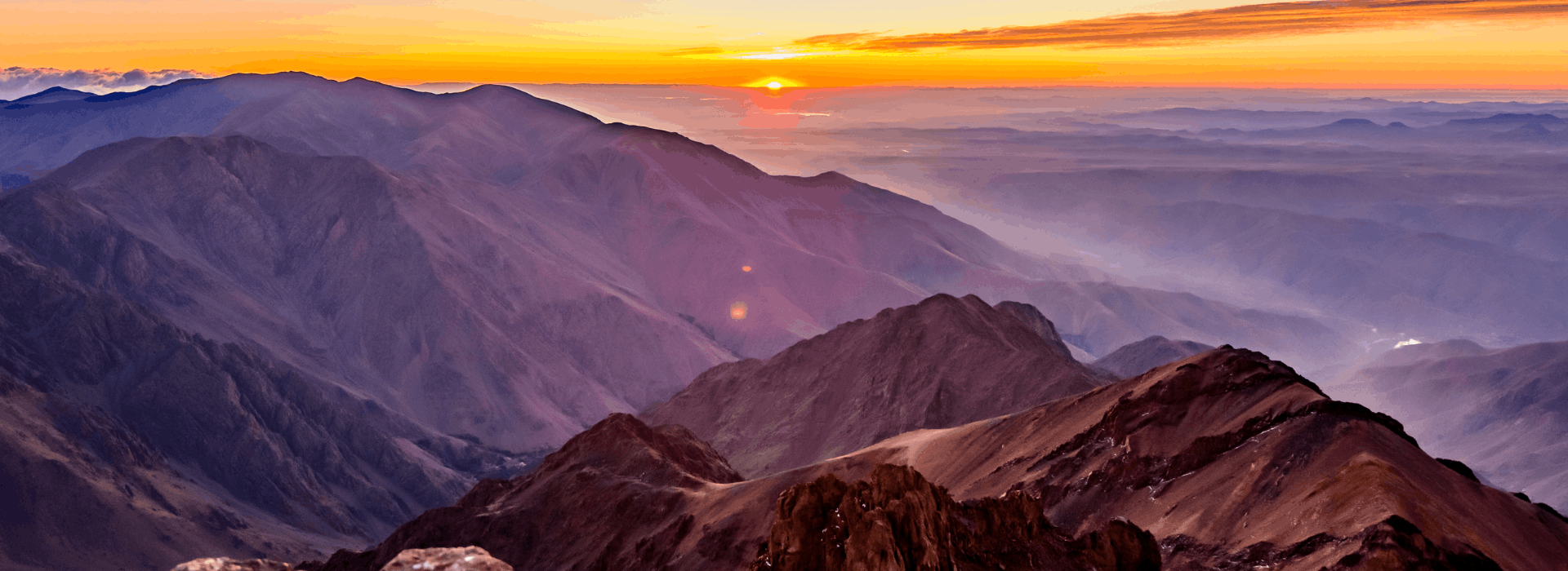 Sunrise view across the Atlas Mountains from high altitude during the Mount Toubkal ascent