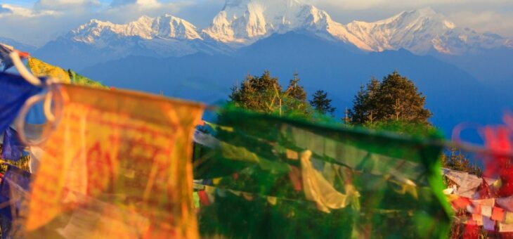 Flags in front of a mountain view in the Annapurna region, Nepal.