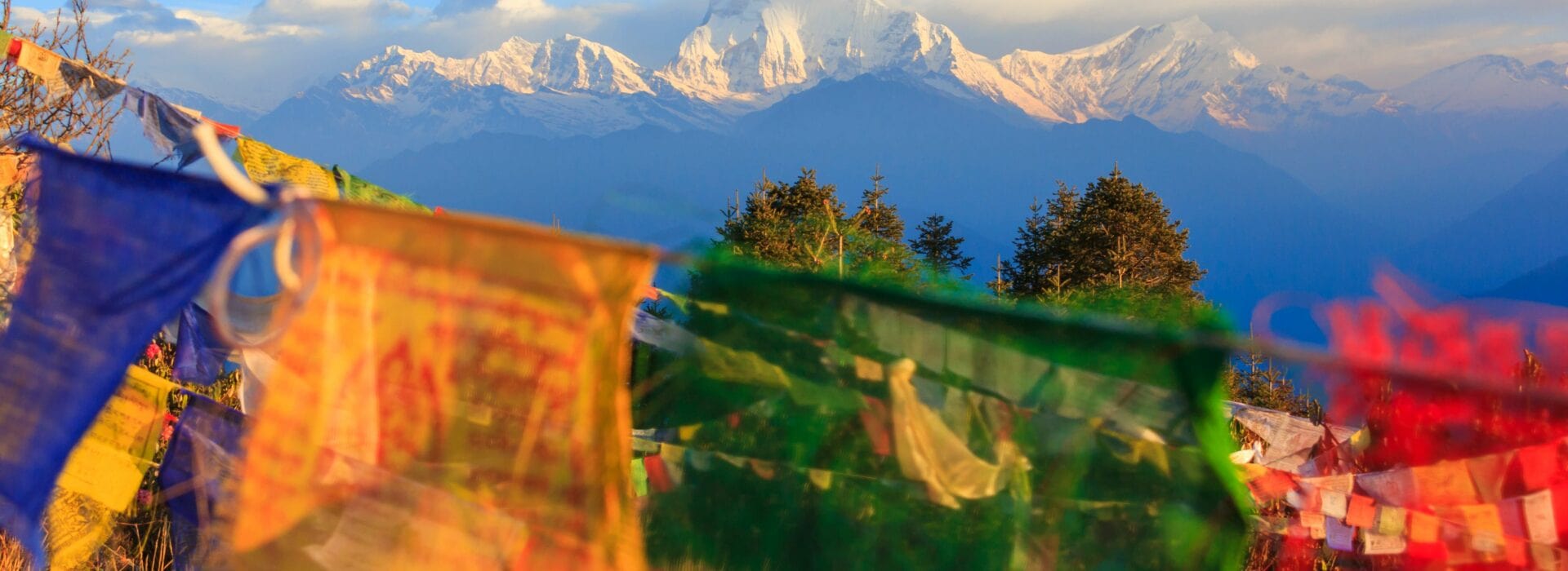Flags in front of a mountain view in the Annapurna region, Nepal.