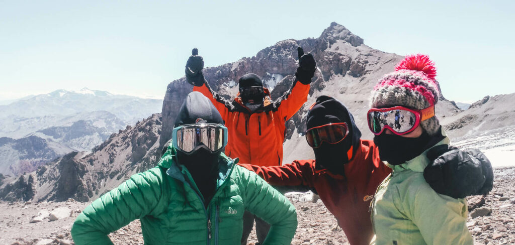 A group of climbers in ski-goggles on Aconcagua in Argentina with Earth's Edge