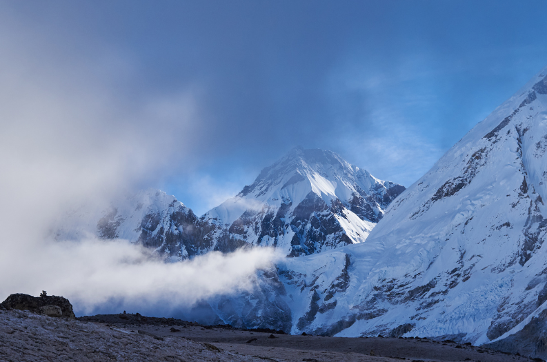 Kala Patthar peak in Nepal, an optional peak on the Three Passes Trek, partially shrouded by clouds
