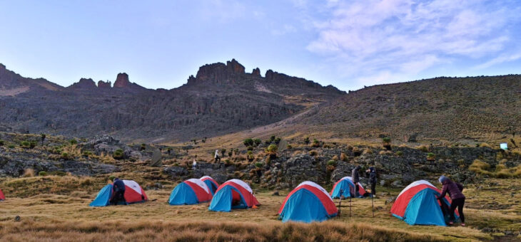 Mount Kenya's jagged peaks over camp on the Kenya Tri-Adventure