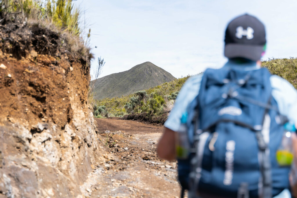 Climbers looking at Mt. Kenya in the distance while trekking during daytime
