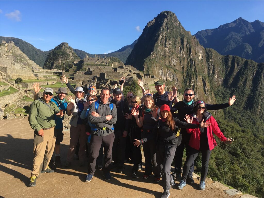 An Earth's Edge Expedition doctor with a group of happy clients at Machu Picchu